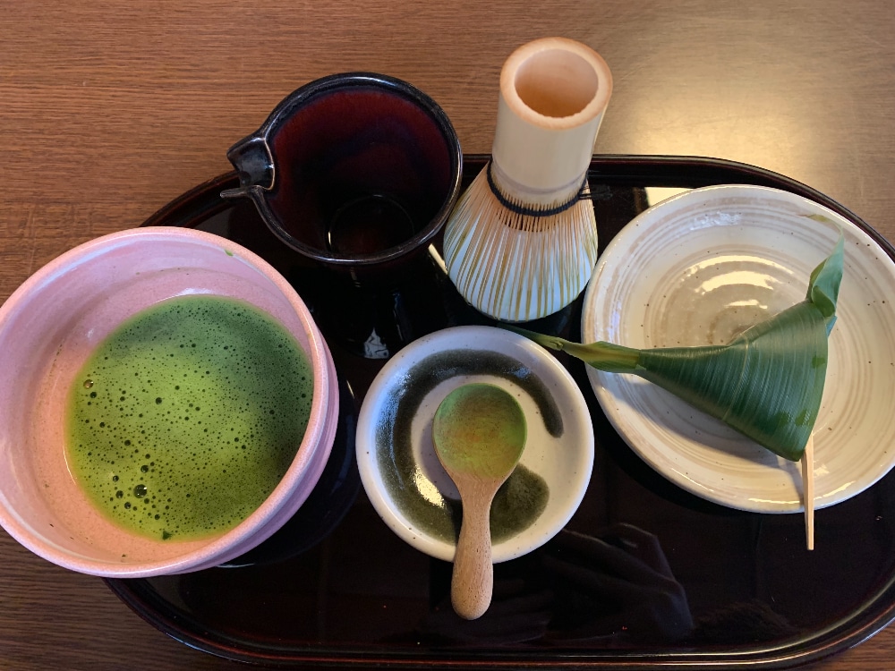 Tea utensils including bamboo whisk, tea scoop, and tea bowl as well as matcha and sweet, Sabo Maeda, Nijo Castle, Kyoto, Japan Photo Credit: Hannah Fulton